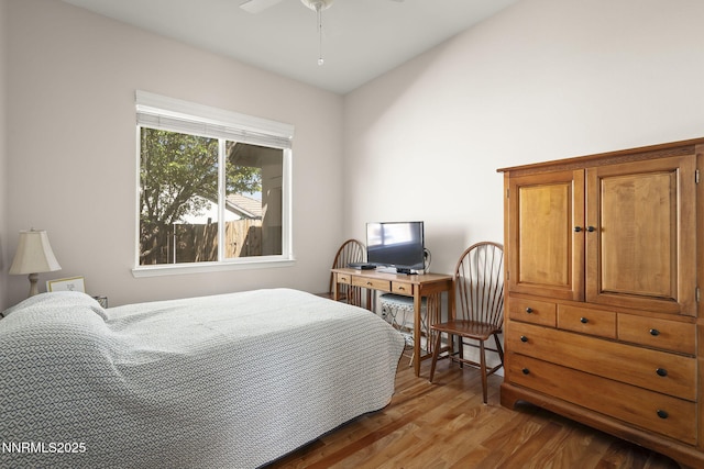 7100 Heatherwood Dr, Reno, NV 89523 - bedroom with wood finished floors and a ceiling fan