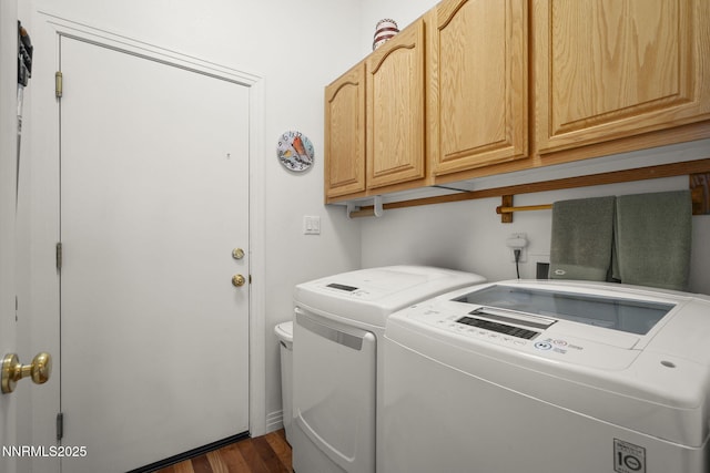 7100 Heatherwood Dr, Reno, NV 89523 - washroom with washer and dryer, cabinet space, and dark wood-style floors