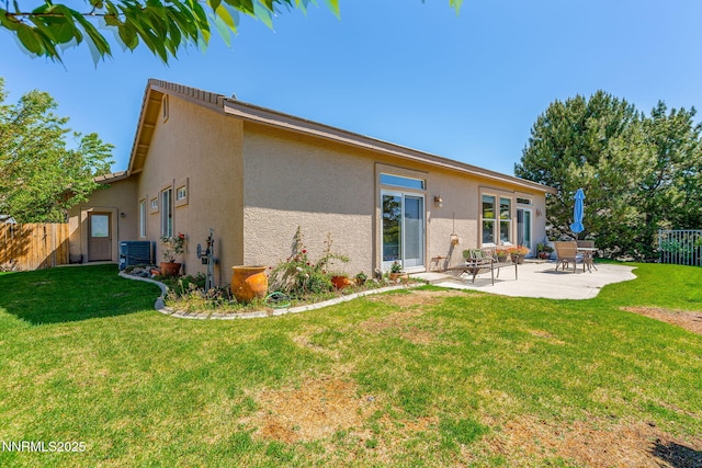7100 Heatherwood Dr, Reno, NV 89523 - back of property featuring stucco siding, central AC unit, and a patio area