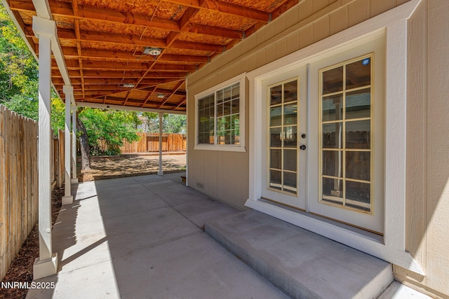 2125 Woodhaven Ln, Sparks, NV 89434 - fenced backyard with french doors and a patio area