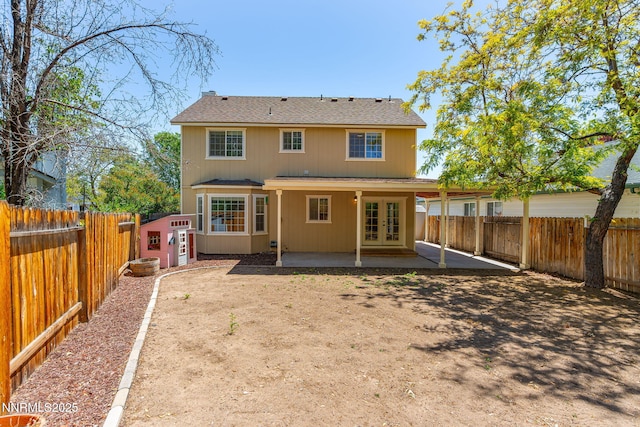 2125 Woodhaven Ln, Sparks, NV 89434 - rear view of property with french doors, a patio, a fenced backyard, and roof with shingles