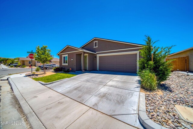 640 Mcgill Dr, Reno, NV 89506 - single story home with concrete driveway, a garage, and stucco siding