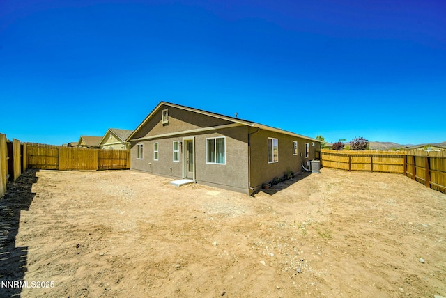 640 Mcgill Dr, Reno, NV 89506 - rear view of house featuring stucco siding, a fenced backyard, and central air condition unit