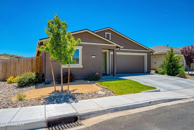 640 Mcgill Dr, Reno, NV 89506 - view of front of property with an attached garage, stucco siding, and driveway