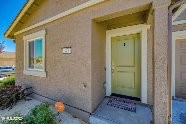 640 Mcgill Dr, Reno, NV 89506 - doorway to property featuring stucco siding