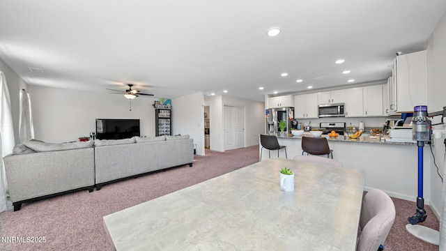 640 Mcgill Dr, Reno, NV 89506 - dining area with light carpet, recessed lighting, ceiling fan, and baseboards