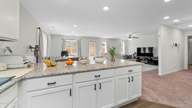 640 Mcgill Dr, Reno, NV 89506 - kitchen with a peninsula, ceiling fan, open floor plan, white cabinets, and recessed lighting