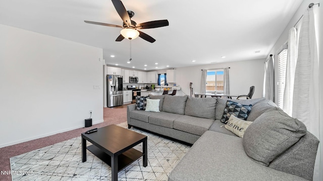 640 Mcgill Dr, Reno, NV 89506 - living area with light colored carpet, ceiling fan, recessed lighting, and baseboards