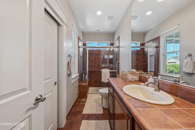 1011 Keystone Ct, Gardnerville, NV 89460 - bathroom featuring vanity, toilet, a stall shower, and recessed lighting