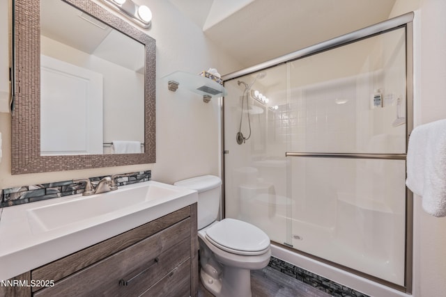 1011 Keystone Ct, Gardnerville, NV 89460 - bathroom with toilet, a shower stall, vanity, and wood finished floors