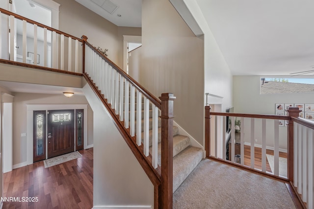 1011 Keystone Ct, Gardnerville, NV 89460 - entrance foyer with wood finished floors, baseboards, and stairway