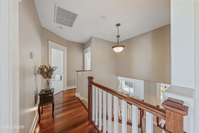 1011 Keystone Ct, Gardnerville, NV 89460 - hallway featuring wood finished floors, an upstairs landing, and baseboards