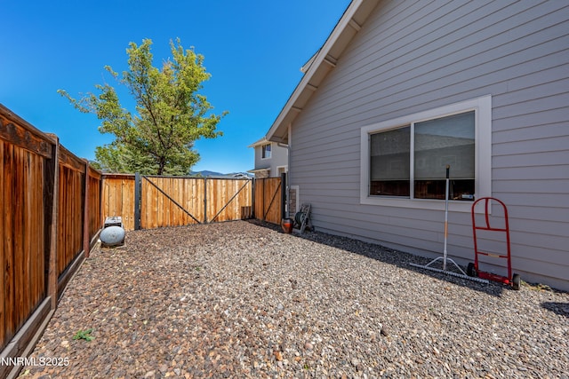 1011 Keystone Ct, Gardnerville, NV 89460 - view of side of home featuring a gate and a fenced backyard