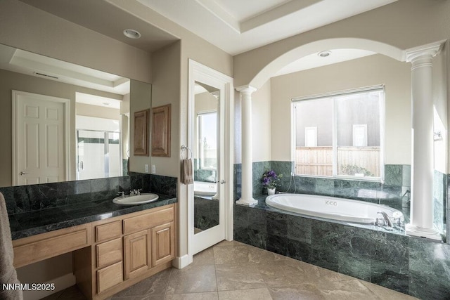 10168 Via Fiori, Reno, NV 89511 - bathroom with decorative columns, a garden tub, vanity, and marble finish floors