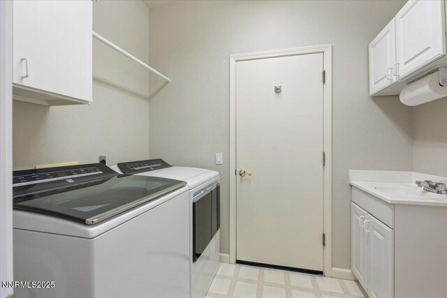 6740 Cinnamon Dr, Sparks, NV 89436 - laundry area with washer and dryer, light flooring, and cabinet space
