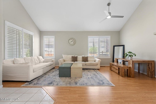 6740 Cinnamon Dr, Sparks, NV 89436 - living room with vaulted ceiling, plenty of natural light, wood finished floors, ceiling fan, and baseboards
