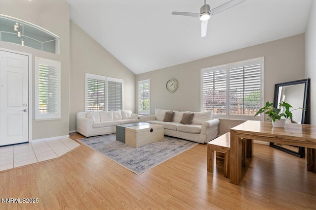 6740 Cinnamon Dr, Sparks, NV 89436 - living room with wood finished floors, high vaulted ceiling, a ceiling fan, and baseboards