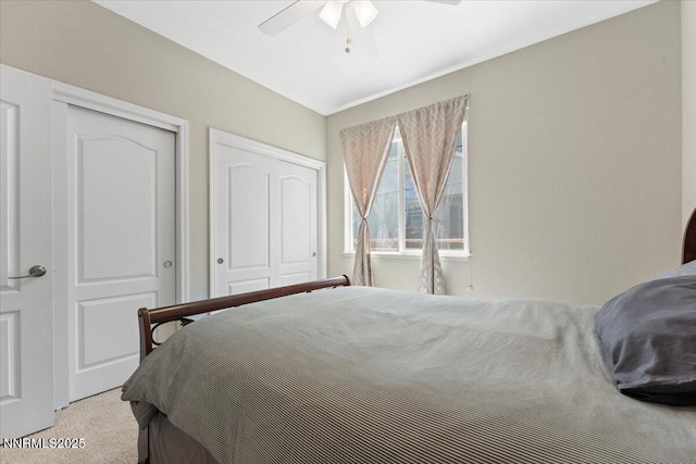 6740 Cinnamon Dr, Sparks, NV 89436 - carpeted bedroom with multiple closets and a ceiling fan