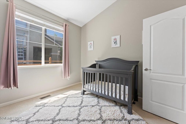 6740 Cinnamon Dr, Sparks, NV 89436 - bedroom featuring carpet flooring, vaulted ceiling, a nursery area, and baseboards