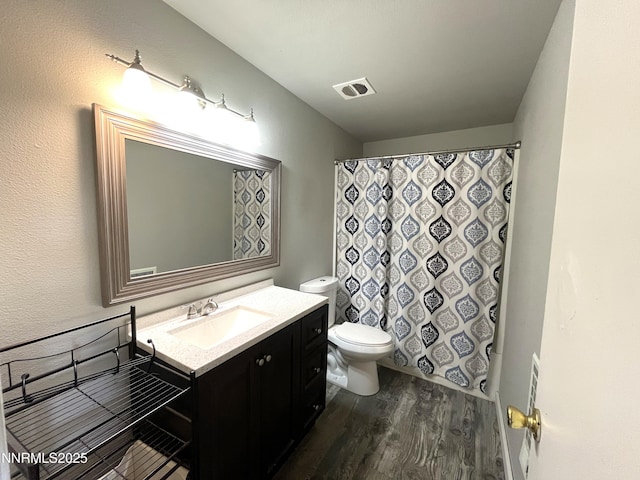 1702 London Cir, Sparks, NV 89431 - bathroom with wood finished floors, vanity, toilet, and a shower with shower curtain