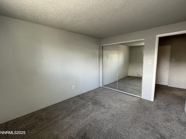 1702 London Cir, Sparks, NV 89431 - unfurnished bedroom with carpet floors, a closet, and a textured ceiling