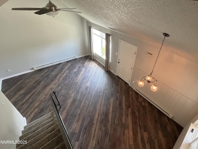 1702 London Cir, Sparks, NV 89431 - foyer featuring a baseboard radiator, dark wood-type flooring, a textured ceiling, a ceiling fan, and baseboards
