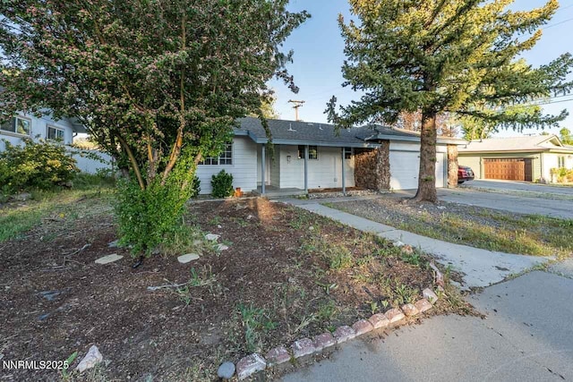 201 N Carson Meadow Dr, Carson City, NV 89701 - ranch-style home featuring concrete driveway, an attached garage, and roof with shingles