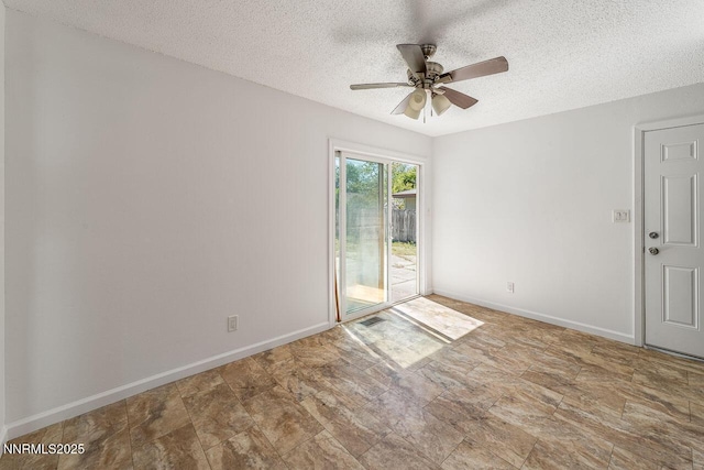 201 N Carson Meadow Dr, Carson City, NV 89701 - spare room featuring a textured ceiling, ceiling fan, baseboards, and stone finish floors