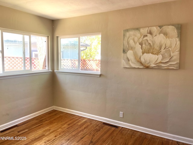 2485 Riviera St, Reno, NV 89509 - unfurnished room featuring healthy amount of natural light, baseboards, and wood finished floors