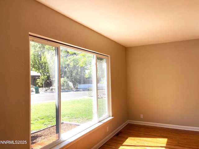 2485 Riviera St, Reno, NV 89509 - unfurnished room featuring healthy amount of natural light, wood finished floors, and baseboards