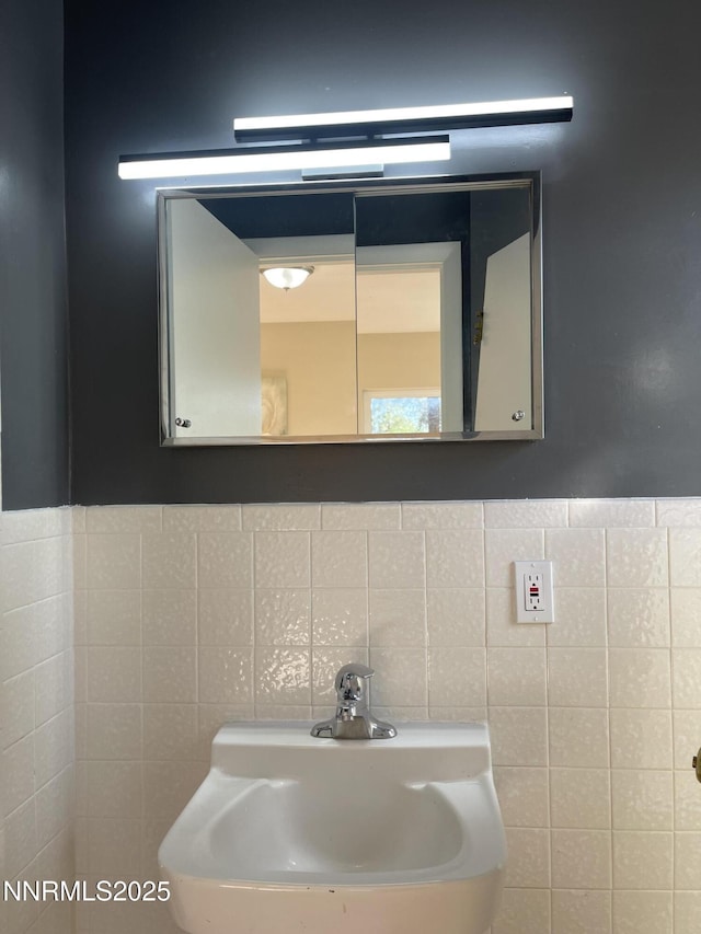 2485 Riviera St, Reno, NV 89509 - bathroom featuring a sink and tile walls