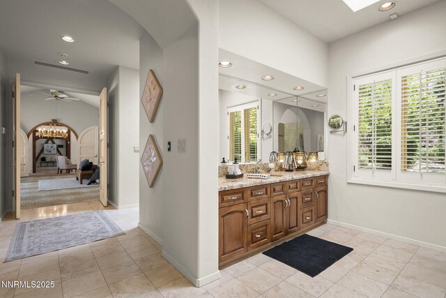 5101 Eldorado Dr, Reno, NV 89519 - bathroom featuring vanity, healthy amount of natural light, connected bathroom, tile patterned flooring, and recessed lighting
