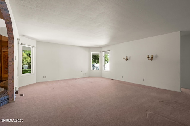 5101 Eldorado Dr, Reno, NV 89519 - unfurnished living room with plenty of natural light, light colored carpet, and baseboards