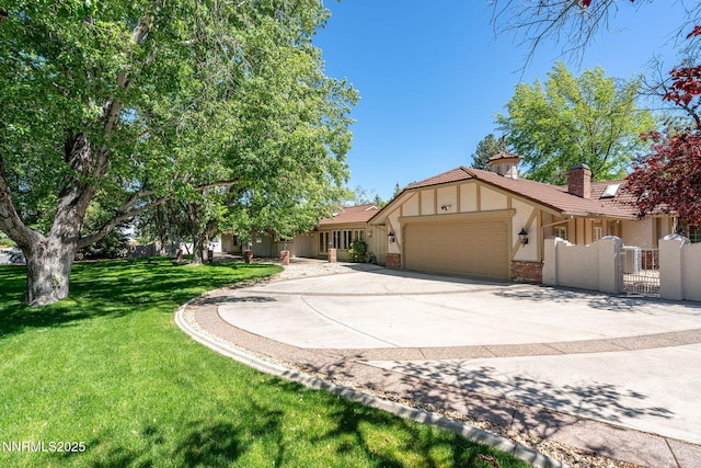5101 Eldorado Dr, Reno, NV 89519 - view of front of property featuring a garage, stucco siding, a gate, a chimney, and concrete driveway