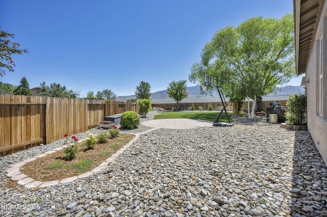 212 Portrush Ct, Dayton, NV 89403 - fenced backyard with a patio and a mountain view