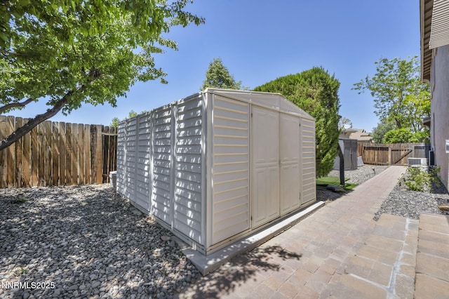212 Portrush Ct, Dayton, NV 89403 - view of shed featuring a fenced backyard and central AC unit