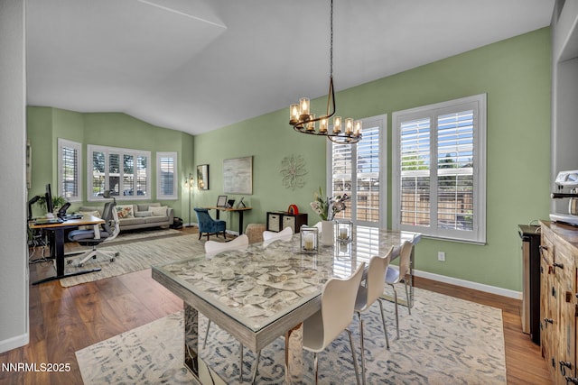 212 Portrush Ct, Dayton, NV 89403 - dining room with a chandelier, lofted ceiling, wood finished floors, and baseboards
