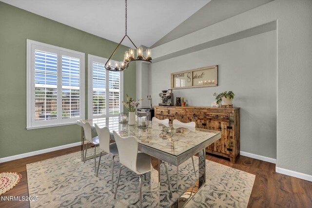 212 Portrush Ct, Dayton, NV 89403 - dining room featuring a chandelier, lofted ceiling, baseboards, and wood finished floors