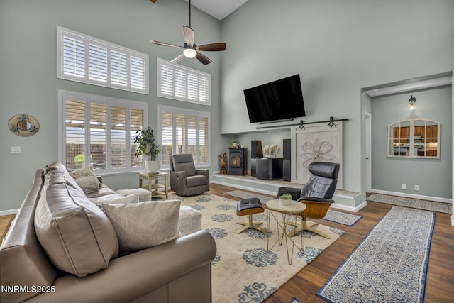 212 Portrush Ct, Dayton, NV 89403 - living area with a towering ceiling, a ceiling fan, wood finished floors, and baseboards