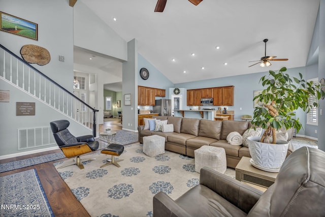 212 Portrush Ct, Dayton, NV 89403 - living room with ceiling fan, high vaulted ceiling, stairway, baseboards, and recessed lighting
