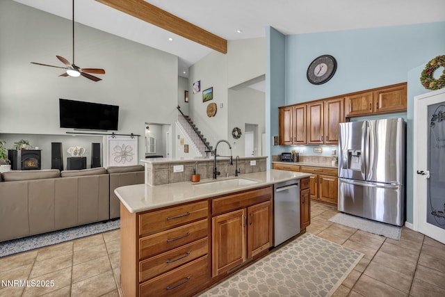 212 Portrush Ct, Dayton, NV 89403 - kitchen with appliances with stainless steel finishes, a sink, high vaulted ceiling, a ceiling fan, and light countertops