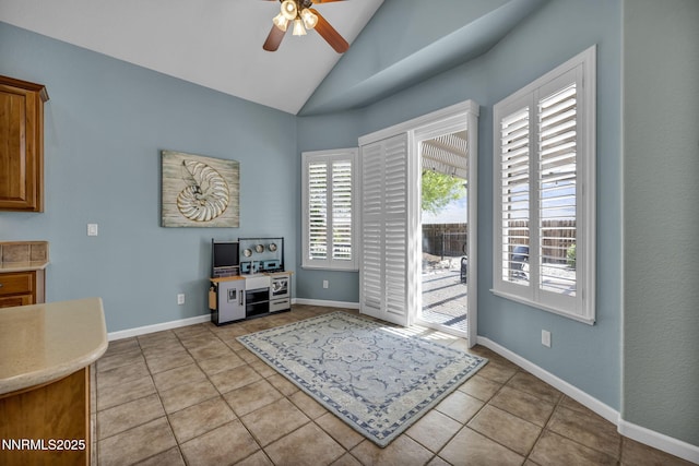 212 Portrush Ct, Dayton, NV 89403 - interior space with ceiling fan, light tile patterned floors, vaulted ceiling, and baseboards
