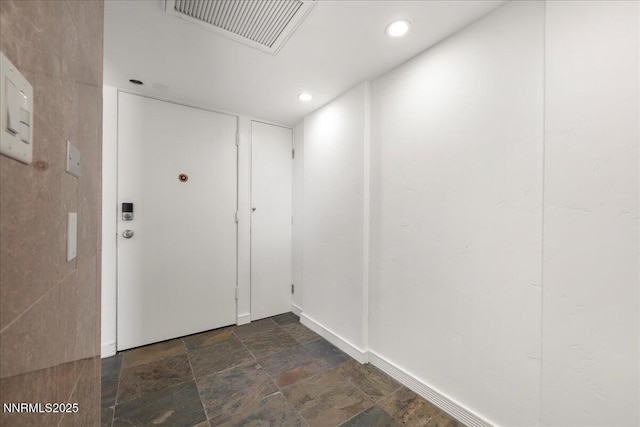 280 Island Ave Apt 906, Reno, NV 89501 - doorway with recessed lighting and dark stone finish floors