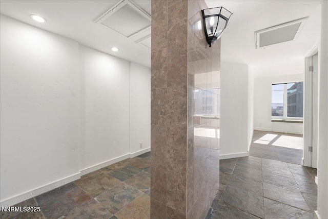280 Island Ave Apt 906, Reno, NV 89501 - unfurnished room featuring attic access, stone finish flooring, and recessed lighting