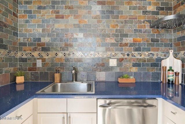 280 Island Ave Apt 906, Reno, NV 89501 - kitchen featuring dishwasher, tasteful backsplash, white cabinets, and dark countertops