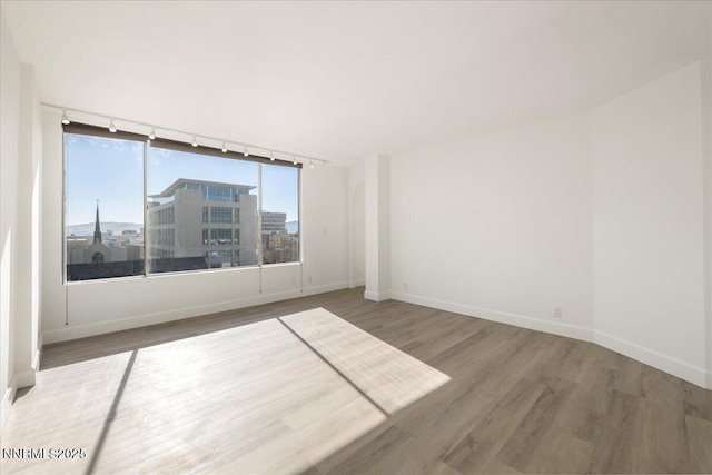 280 Island Ave Apt 906, Reno, NV 89501 - spare room with wood finished floors and track lighting