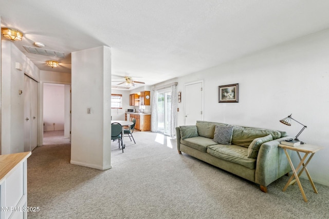 1341 Leonard Rd, Gardnerville, NV 89460 - living area with light carpet and a ceiling fan