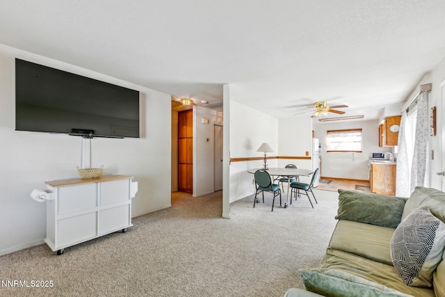 1341 Leonard Rd, Gardnerville, NV 89460 - living area featuring ceiling fan, light colored carpet, and baseboards