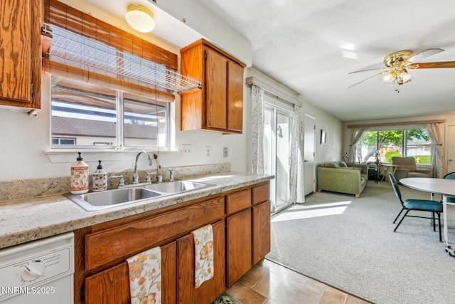 1341 Leonard Rd, Gardnerville, NV 89460 - kitchen featuring a sink, a ceiling fan, open floor plan, white dishwasher, and brown cabinetry
