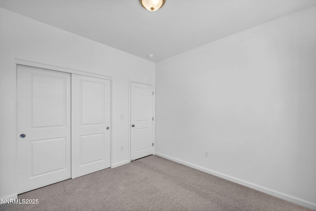 6776 Shell Ct Lot 51, Fernley, NV 89408 - unfurnished bedroom featuring carpet, a closet, and baseboards